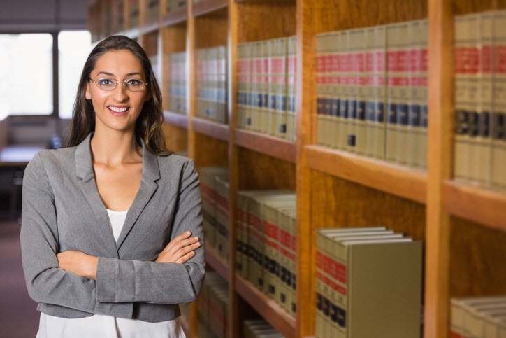 Young, female lawyer in law library
