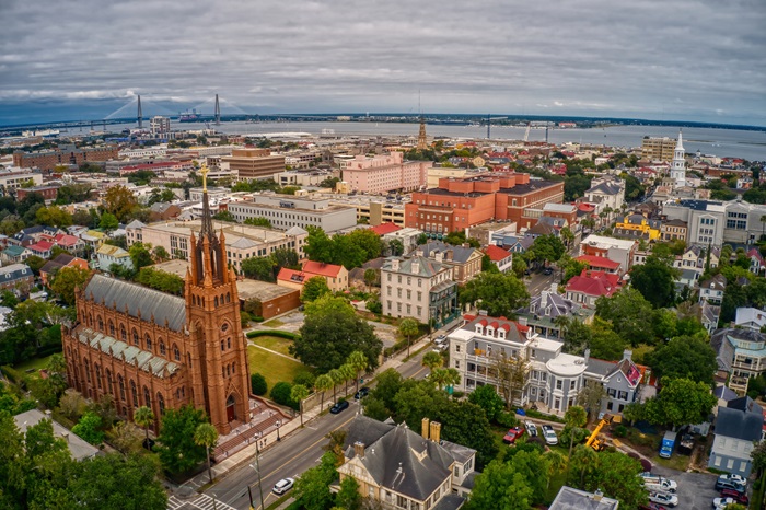 A beautiful aerial view of Charleston with dense buildings under a cloudy sky in South Carolina